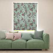 Floral blackout window blind with dusty rose blossoms and dark trailing stems on a soft sage green ground - Lolli & Omi